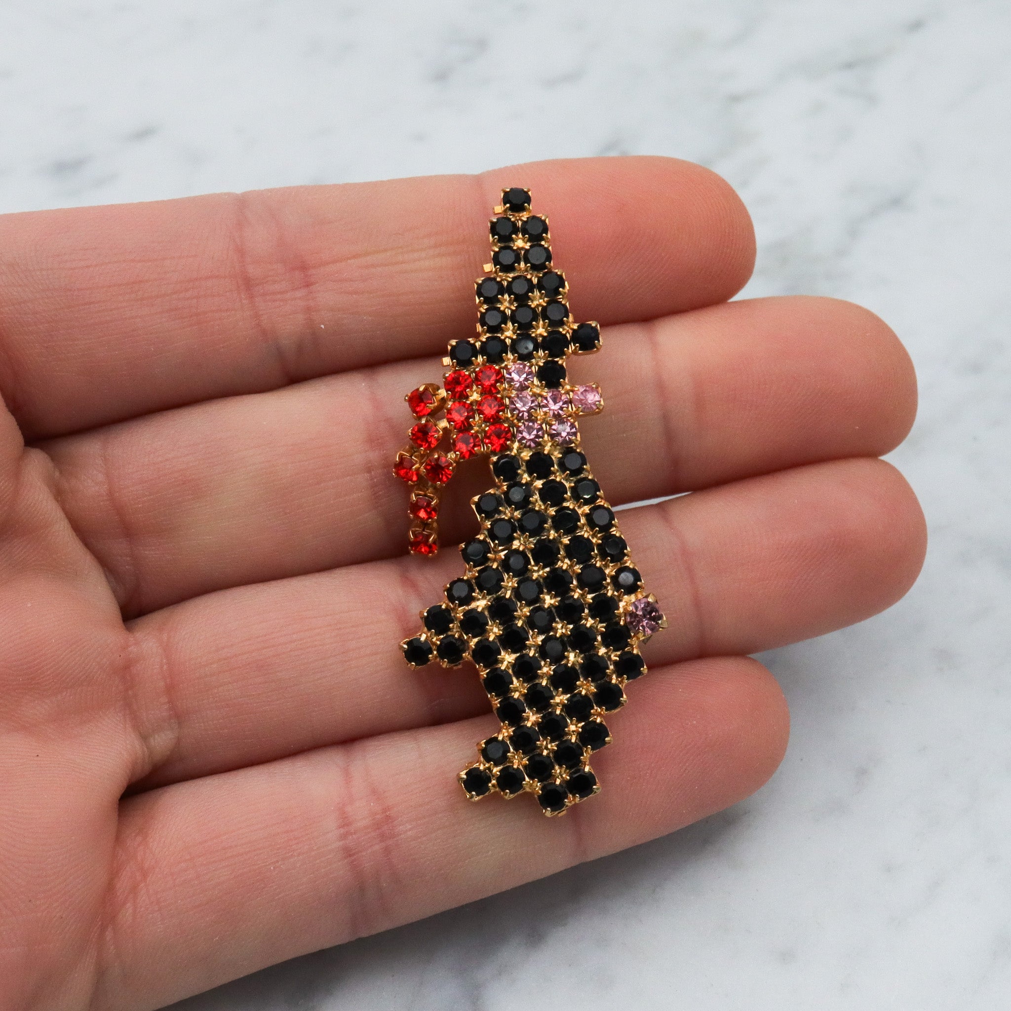 Vintage gold tone rhinestone witch brooch